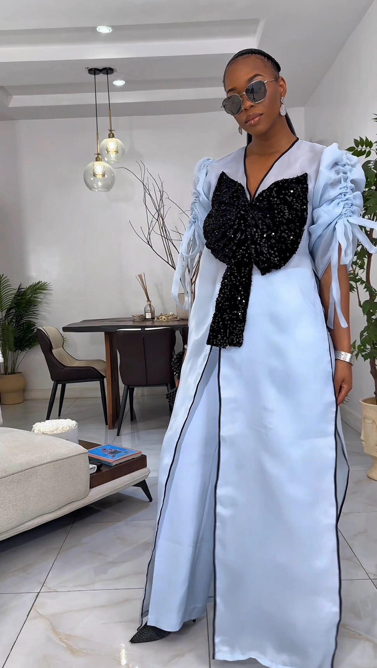 Blue kimono with black bow sequin and wide leg pant set.