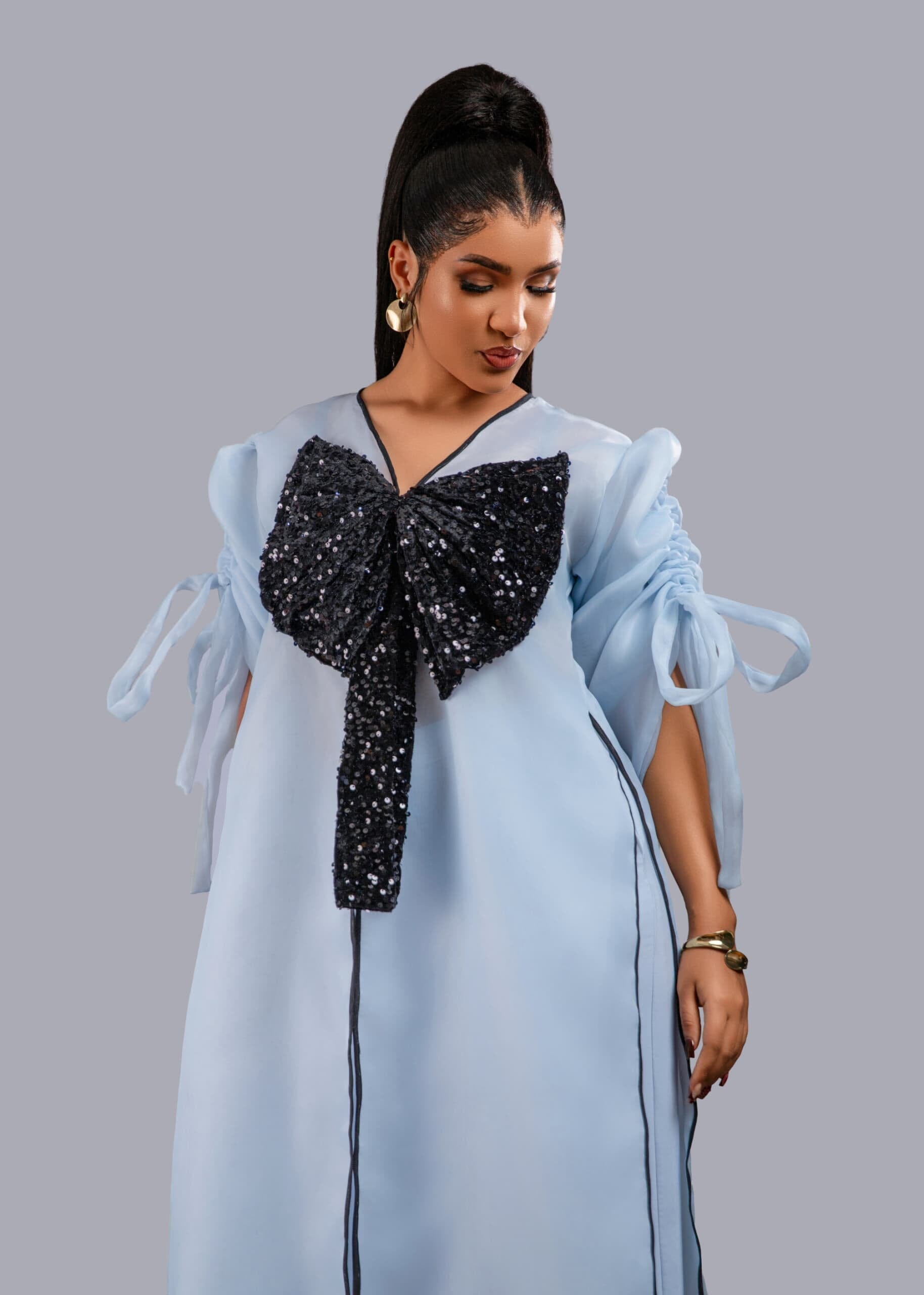 Blue kimono pant set with black sequin bow detail for special occasions